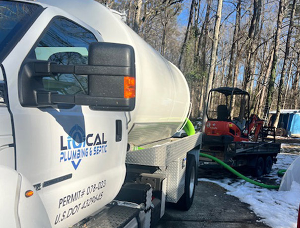 local plumbing and septic pumping truck